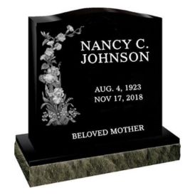 Black curved top headstone with flower engraving and name Nancy C. Johnson